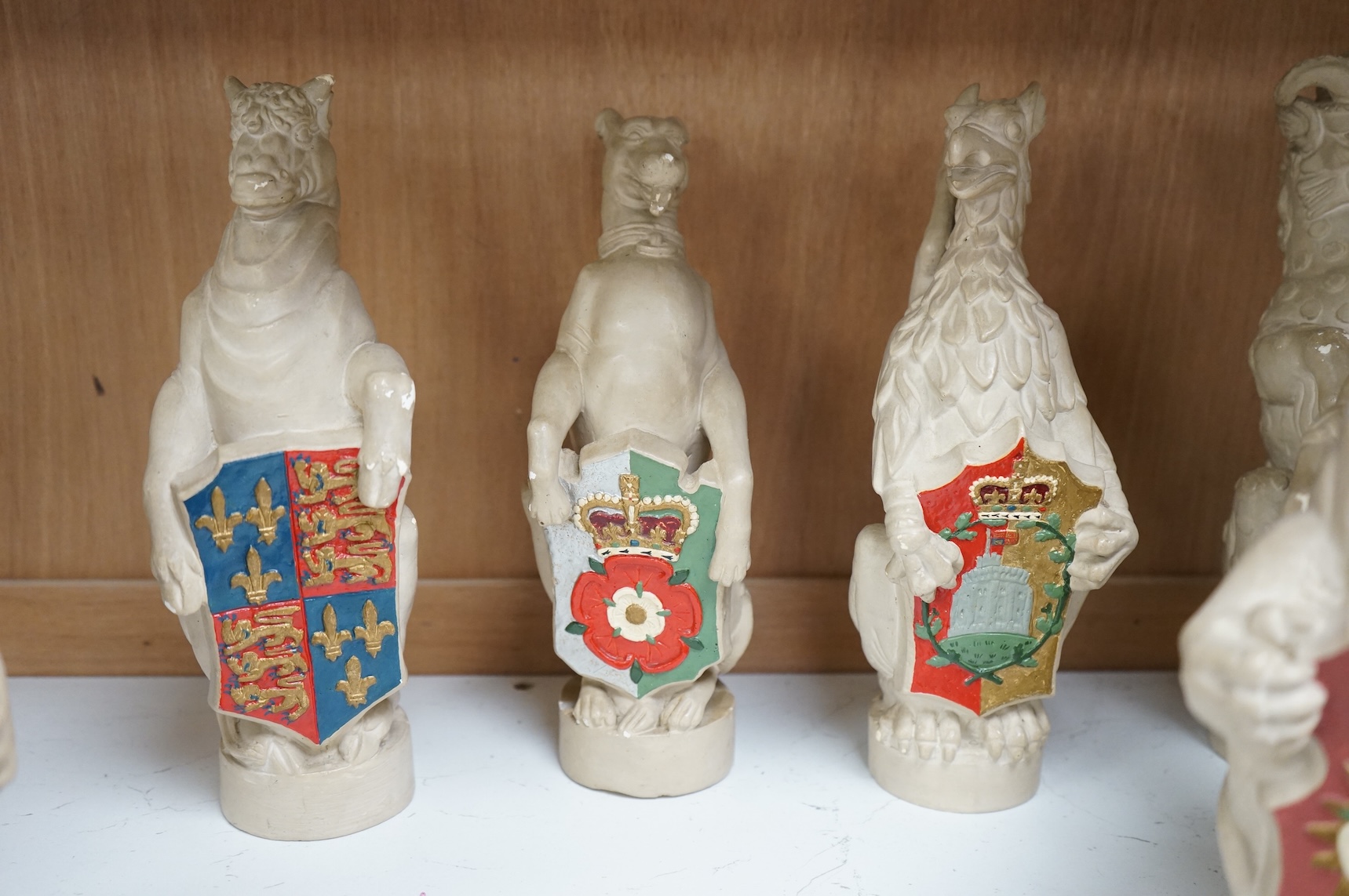 James Woodford, ten painted plaster figures of the Queen's Beasts, inscribed and dated 1953, 26cm high